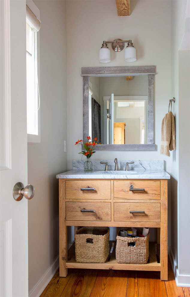 Inspiration for a coastal bathroom remodel in San Francisco with medium tone wood cabinets and flat-panel cabinets