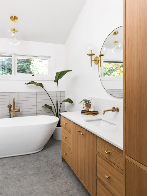 Oak Allure: Vanity with Concrete Floor and Brass Accents Bathroom Storage