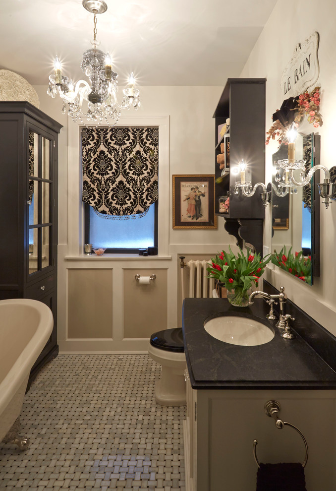 Example of a classic master gray tile marble floor claw-foot bathtub design in Chicago with an undermount sink, beaded inset cabinets, white cabinets and soapstone countertops