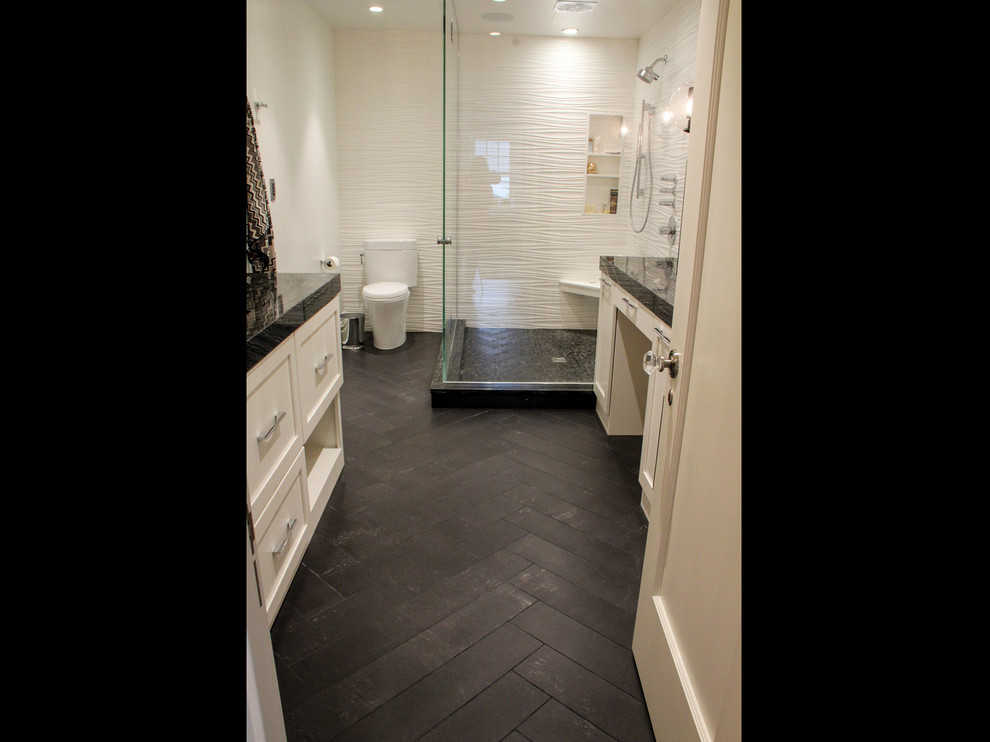 Inspiration for a mid-sized timeless kids' black tile corner shower remodel in Other with white cabinets, white walls and recessed-panel cabinets