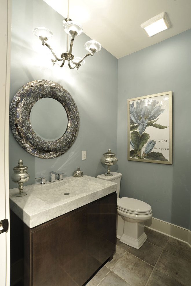 Trendy 3/4 single-sink bathroom photo in Columbus with an integrated sink, flat-panel cabinets, dark wood cabinets, a two-piece toilet, blue walls and a built-in vanity