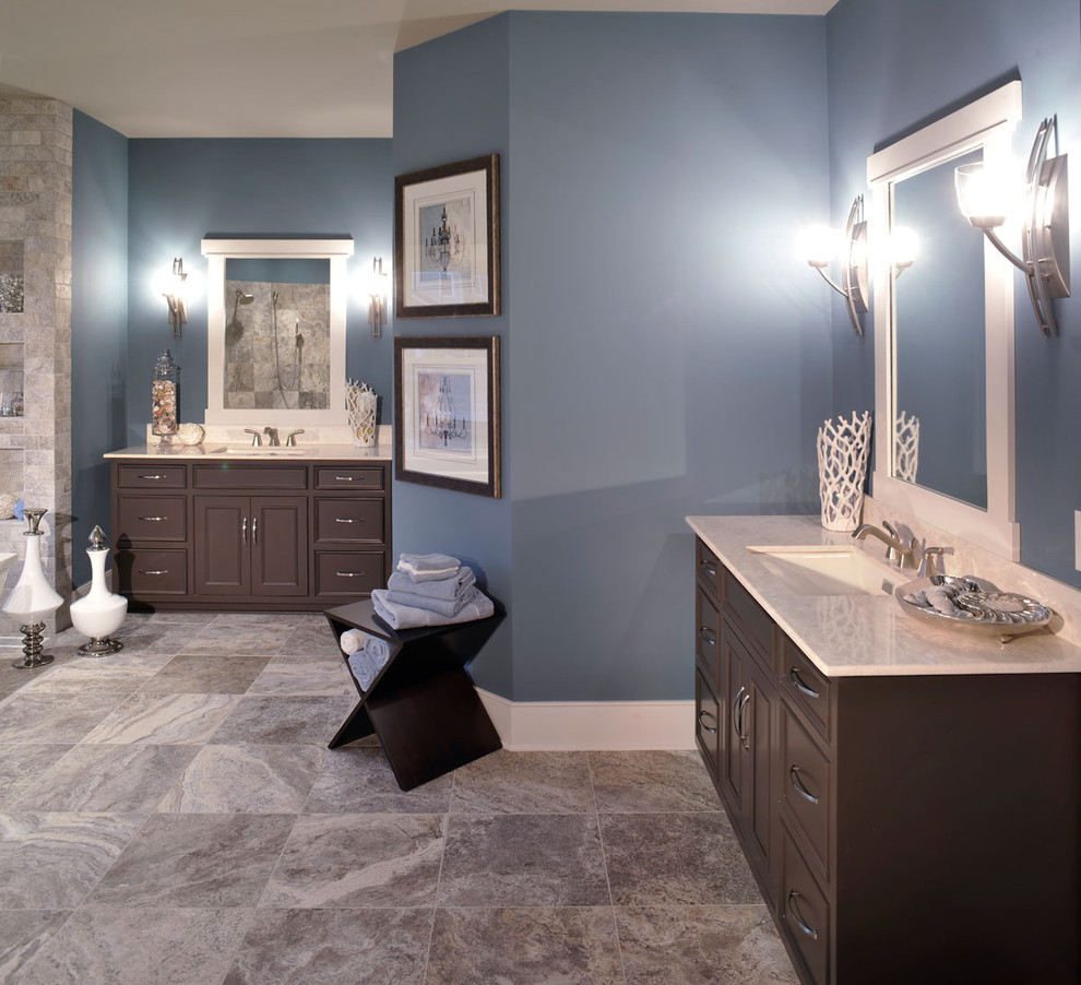 Inspiration for a contemporary master beige tile and stone tile brown floor and double-sink bathroom remodel in Columbus with an undermount sink, dark wood cabinets, beaded inset cabinets, a built-in vanity, blue walls and a hinged shower door