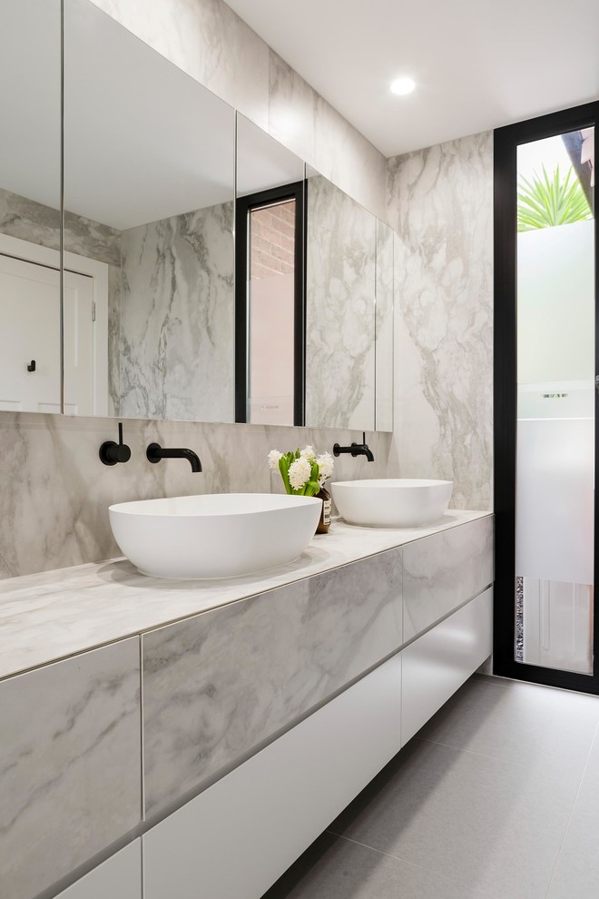 Design ideas for a contemporary bathroom in Melbourne with porcelain tiles and porcelain flooring.