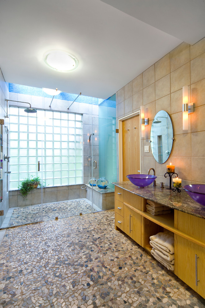 Inspiration for a modern beige tile and pebble tile pebble tile floor and multicolored floor walk-in shower remodel in Dallas with a vessel sink, flat-panel cabinets and white cabinets