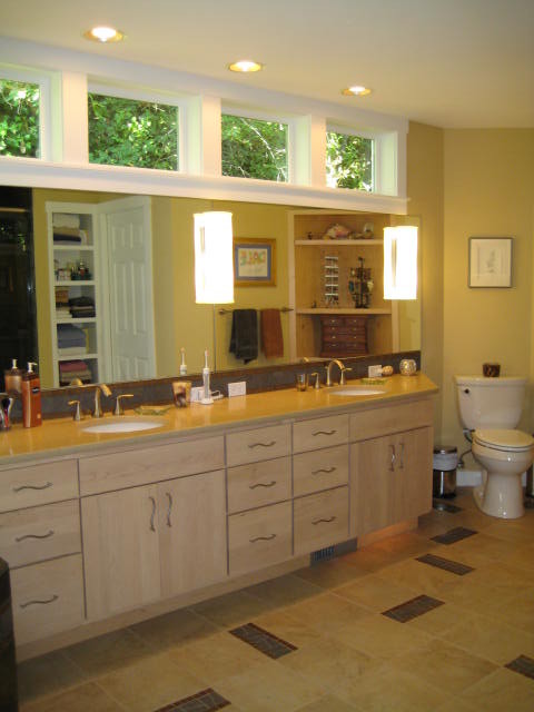 Large trendy master yellow tile and porcelain tile corner bathtub photo in Seattle with an undermount sink, flat-panel cabinets, light wood cabinets, quartz countertops, a two-piece toilet and yellow walls