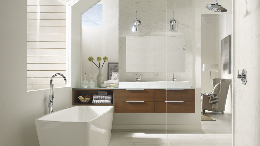 Inspiration for a contemporary ensuite bathroom in Bridgeport with flat-panel cabinets, dark wood cabinets, a freestanding bath, white tiles, ceramic tiles, white walls, a vessel sink, glass worktops and a hinged door.