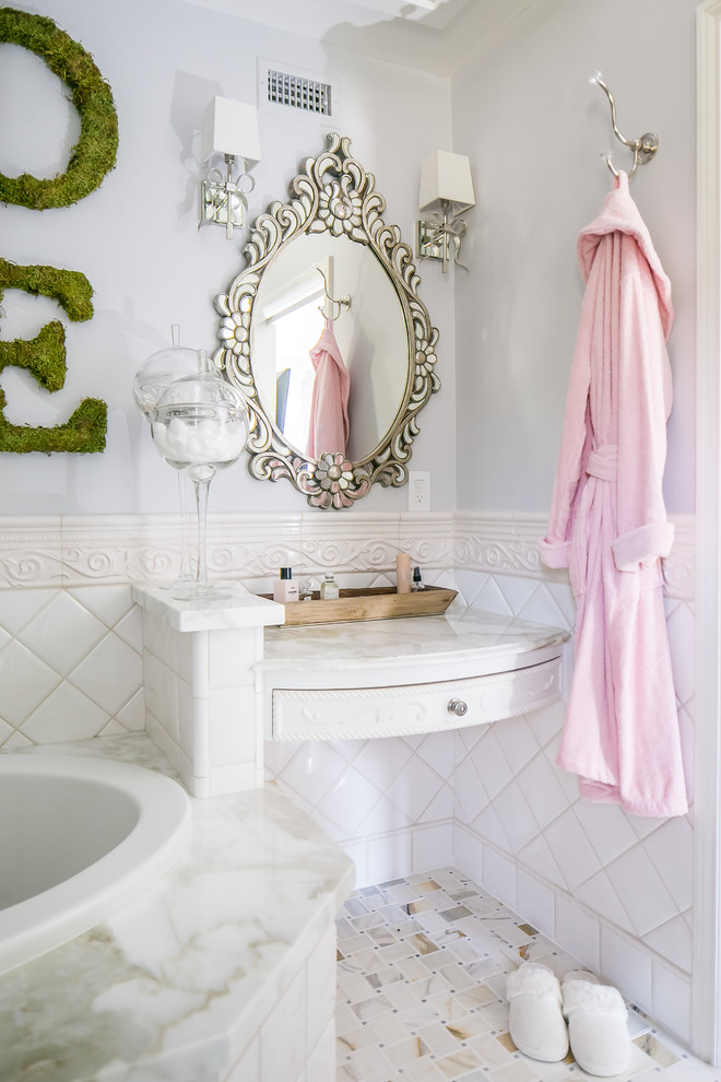 Design ideas for a medium sized victorian ensuite bathroom in Orange County with raised-panel cabinets, white cabinets, grey walls, marble worktops, an alcove bath, white tiles, porcelain tiles, porcelain flooring and multi-coloured floors.