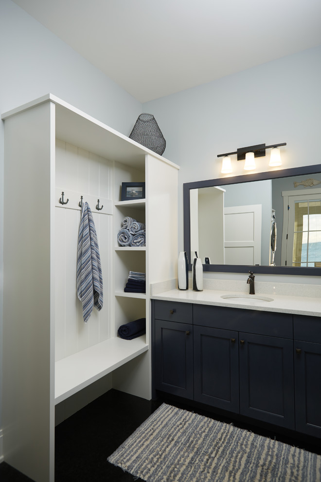 Example of a mid-sized classic kids' white tile and porcelain tile porcelain tile doorless shower design in Grand Rapids with recessed-panel cabinets, gray walls, an undermount sink and marble countertops