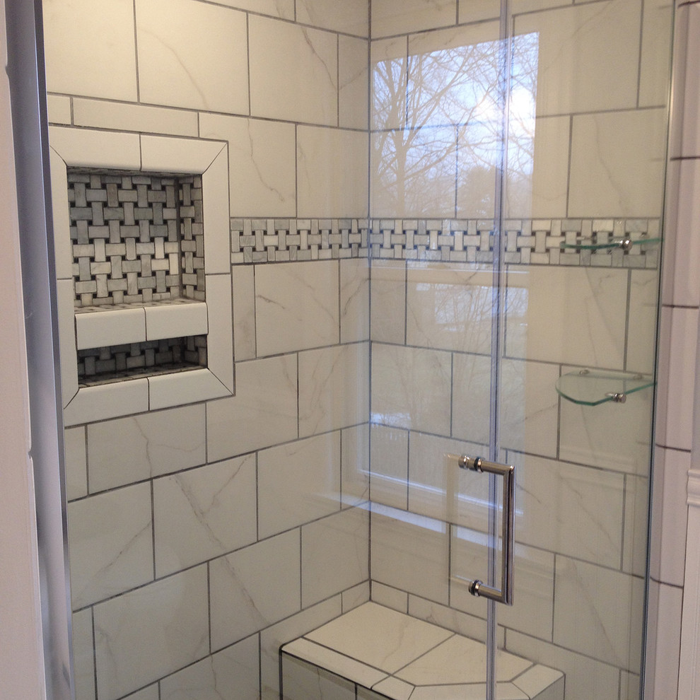 Photo of a medium sized traditional shower room bathroom in Boston with a submerged sink, raised-panel cabinets, white cabinets, granite worktops, an alcove shower, a two-piece toilet, white tiles, porcelain tiles, grey walls and porcelain flooring.