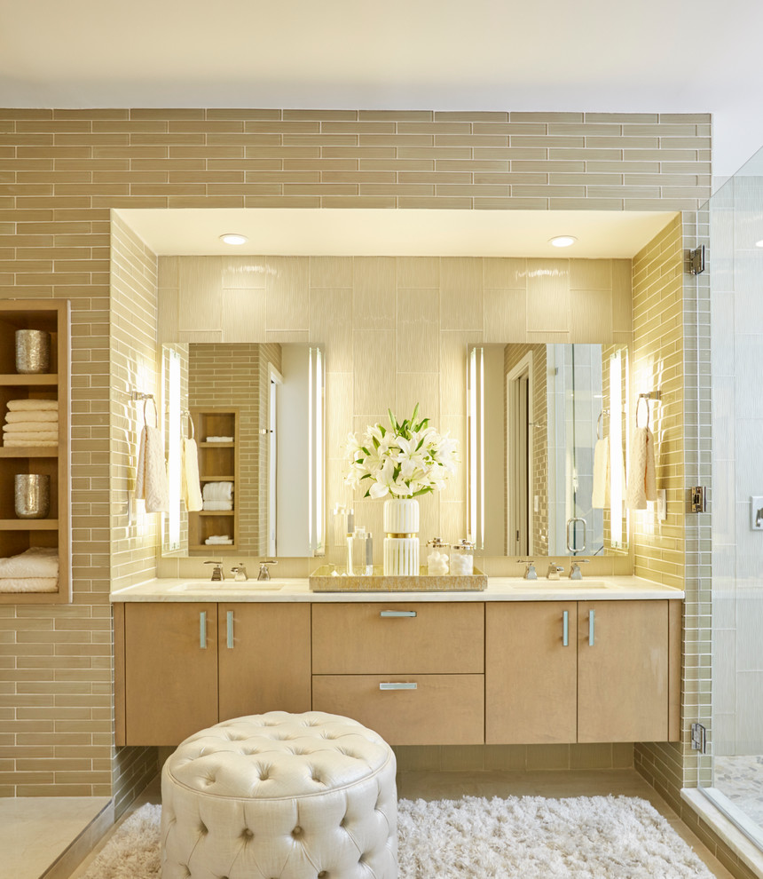 Design ideas for a large contemporary ensuite wet room bathroom in New Orleans with flat-panel cabinets, light wood cabinets, a freestanding bath, beige tiles, metro tiles, a submerged sink, marble worktops, marble flooring, a hinged door, brown walls and white floors.