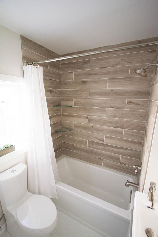 Small transitional 3/4 brown tile and porcelain tile porcelain tile and white floor bathroom photo in Philadelphia with flat-panel cabinets, dark wood cabinets, a two-piece toilet, beige walls, a wall-mount sink and solid surface countertops