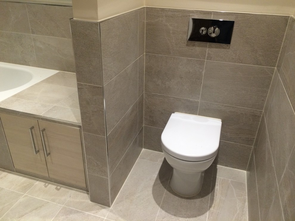 This is an example of a contemporary bathroom in Berkshire with brown walls.