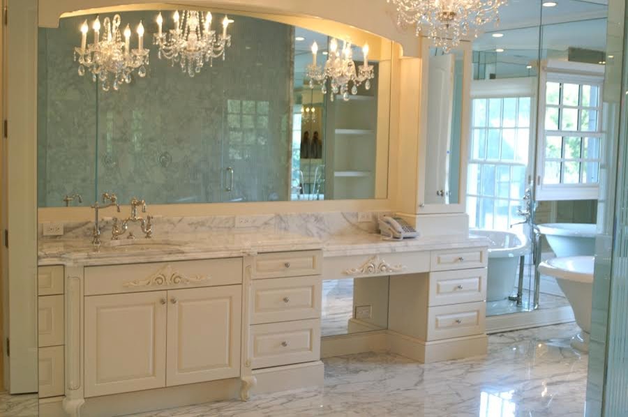 Freestanding bathtub - large traditional master marble floor freestanding bathtub idea in Chicago with raised-panel cabinets, white cabinets, white walls, an integrated sink and marble countertops