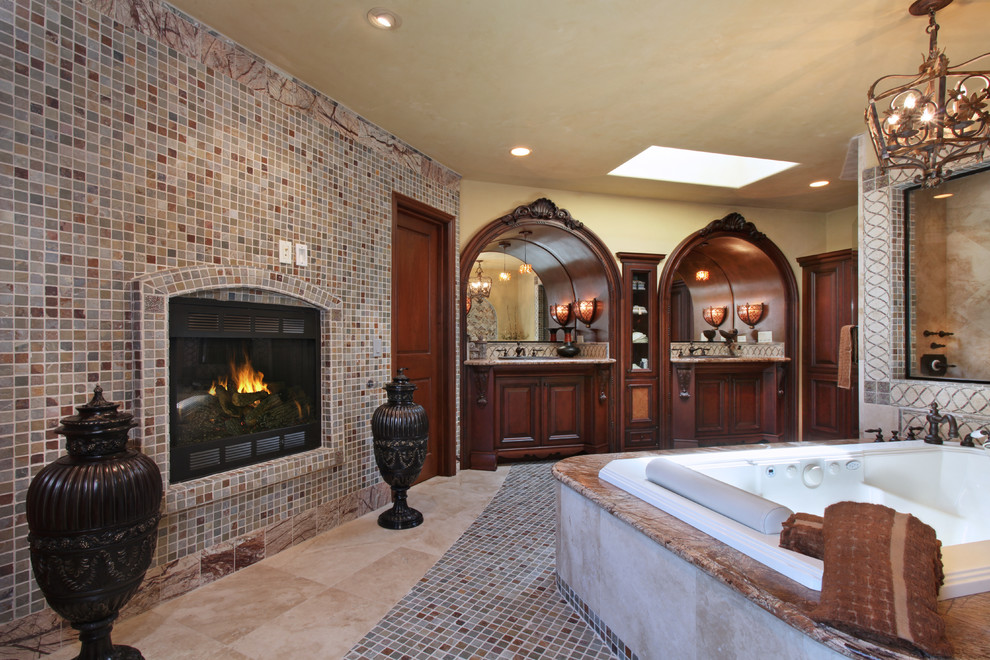 Huge tuscan master multicolored tile and mosaic tile porcelain tile corner shower photo in Orange County with dark wood cabinets, a hot tub, beige walls, an undermount sink, granite countertops and raised-panel cabinets