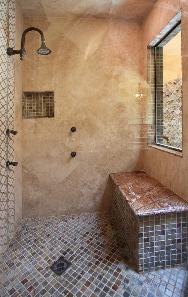 Expansive mediterranean ensuite bathroom in Orange County with freestanding cabinets, dark wood cabinets, a hot tub, a corner shower, multi-coloured tiles, mosaic tiles, beige walls, porcelain flooring, a submerged sink and granite worktops.