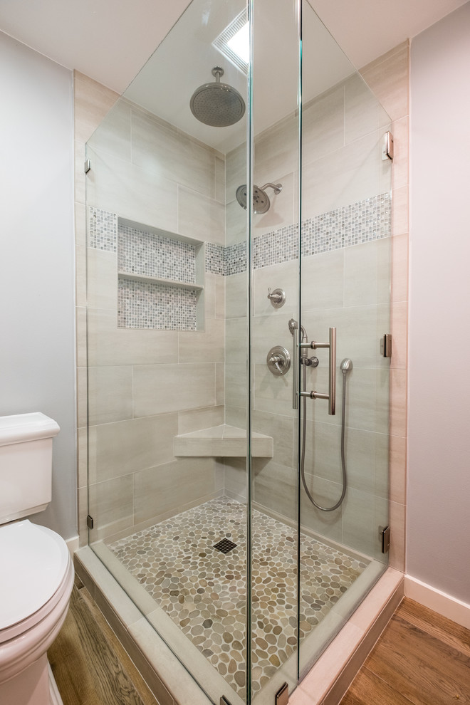 Photo of a small traditional shower room bathroom in Orange County with shaker cabinets, dark wood cabinets, a corner shower, multi-coloured tiles, mosaic tiles, porcelain flooring, a two-piece toilet, a hinged door, brown floors, grey walls, a submerged sink and quartz worktops.