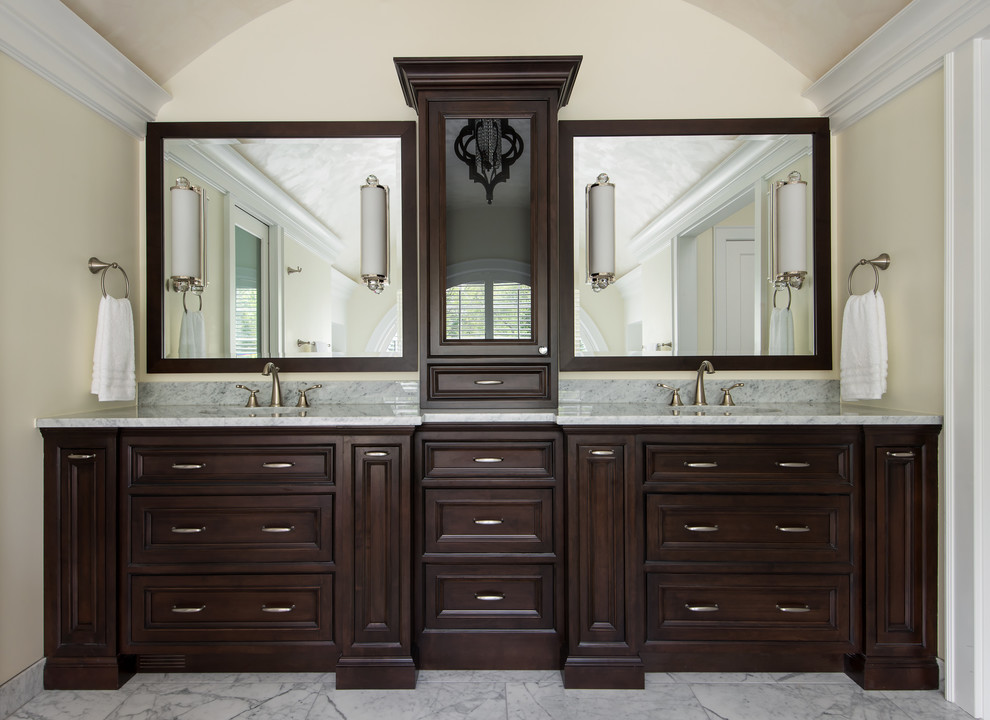 Bathroom - large craftsman master white tile and ceramic tile marble floor and multicolored floor bathroom idea in Detroit with beaded inset cabinets, dark wood cabinets, a two-piece toilet, beige walls, an undermount sink, marble countertops, a hinged shower door and multicolored countertops