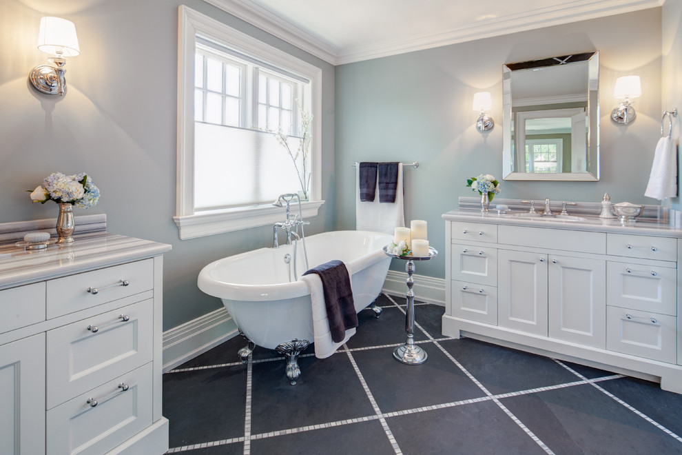 Transitional black tile and stone tile porcelain tile claw-foot bathtub photo in Toronto with an undermount sink, shaker cabinets, white cabinets, marble countertops and blue walls