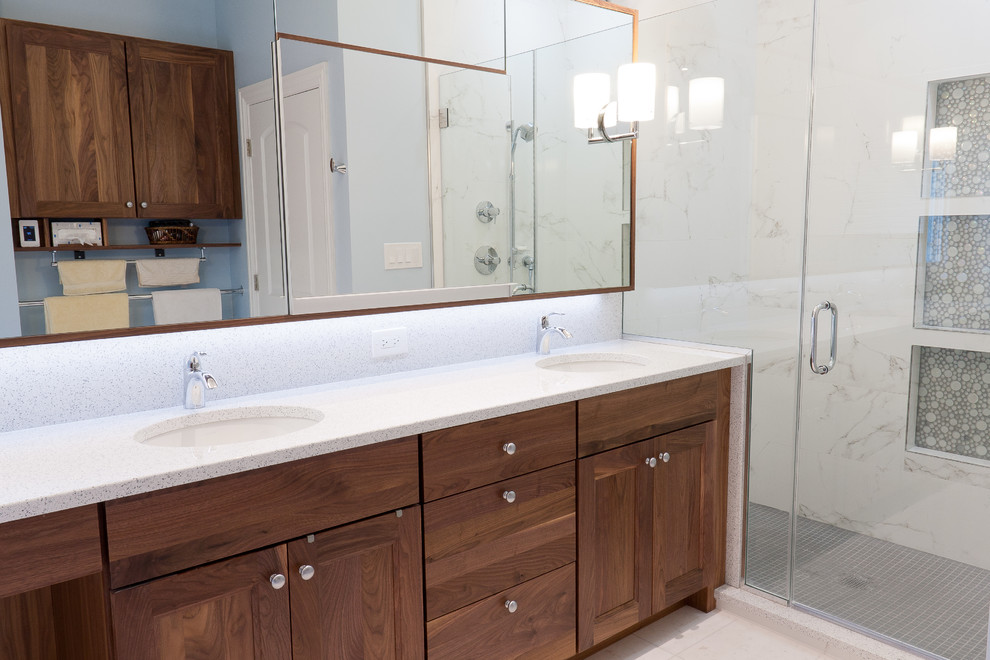 Inspiration for a medium sized contemporary ensuite bathroom in Chicago with recessed-panel cabinets, medium wood cabinets, an alcove shower, grey tiles, white tiles, marble tiles, marble flooring, a submerged sink, quartz worktops, white floors and a hinged door.