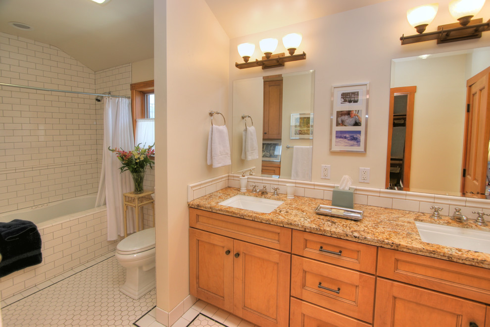 Bathroom - large traditional white tile and subway tile porcelain tile bathroom idea in Santa Barbara with a vessel sink, recessed-panel cabinets, light wood cabinets, granite countertops, a two-piece toilet and white walls