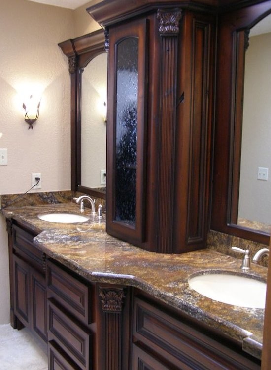 Bathroom - mid-sized bathroom idea in Phoenix with raised-panel cabinets, dark wood cabinets, marble countertops and white walls