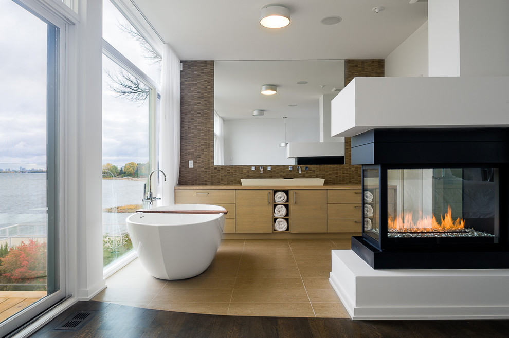 Inspiration for a contemporary freestanding bathtub remodel in Ottawa with a vessel sink