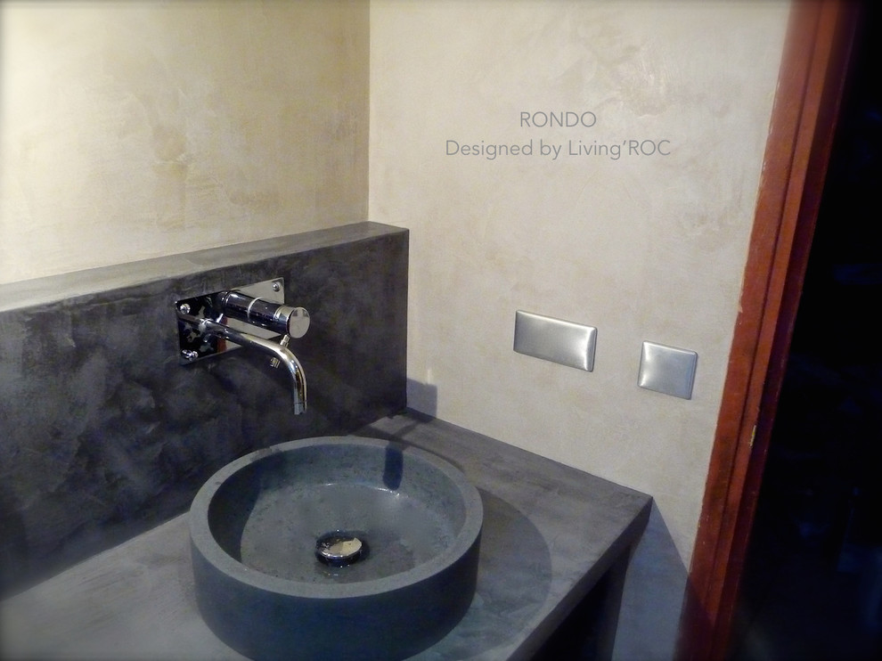 This is an example of a medium sized contemporary bathroom in Other with a vessel sink.