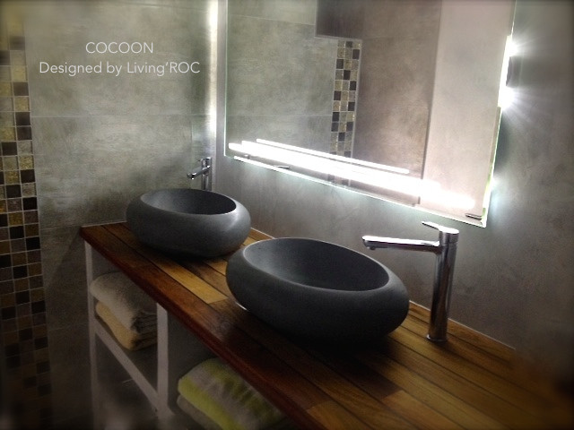 This is an example of a medium sized contemporary bathroom in Other with a vessel sink.