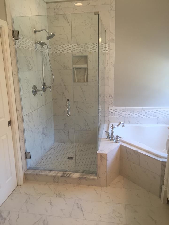 Photo of a medium sized traditional ensuite bathroom in Charlotte with a corner bath, a corner shower, white tiles, porcelain tiles, grey walls, porcelain flooring, white floors and a hinged door.