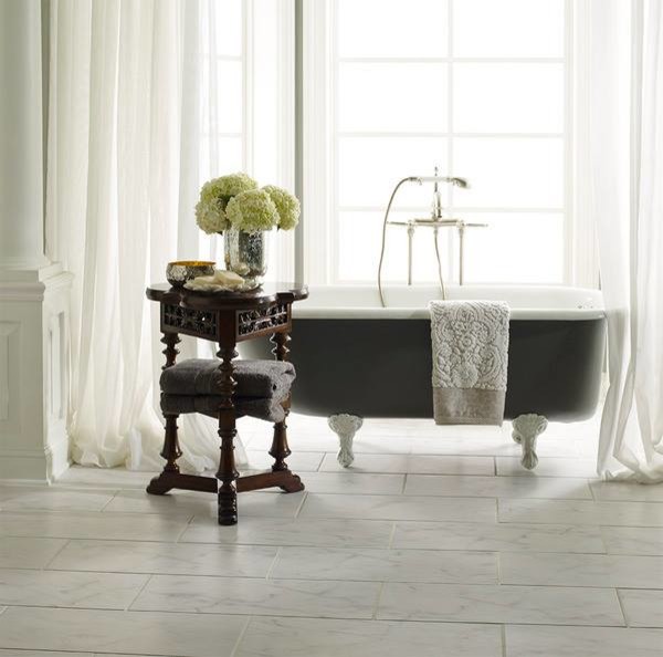Photo of a medium sized classic ensuite bathroom in Other with a claw-foot bath and marble flooring.