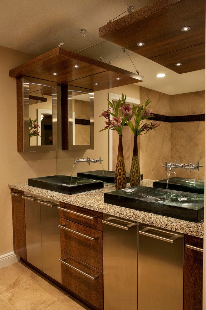 Photo of a medium sized modern ensuite bathroom in Orlando with a vessel sink, flat-panel cabinets, medium wood cabinets, engineered stone worktops, beige tiles, beige walls, ceramic flooring and beige floors.