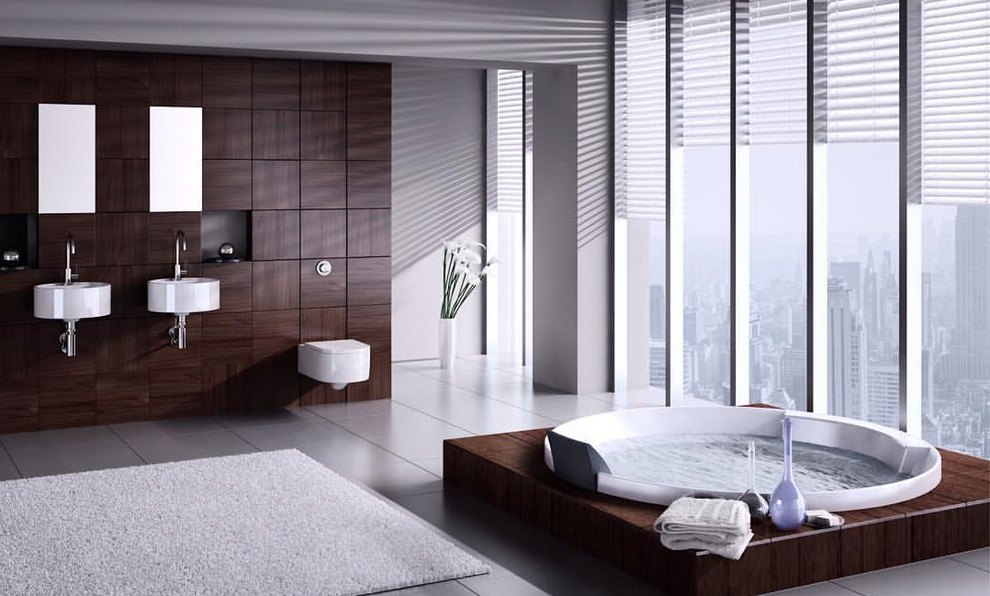 Foto på ett stort funkis en-suite badrum, med en jacuzzi, en vägghängd toalettstol, grå väggar, ett väggmonterat handfat och grått golv