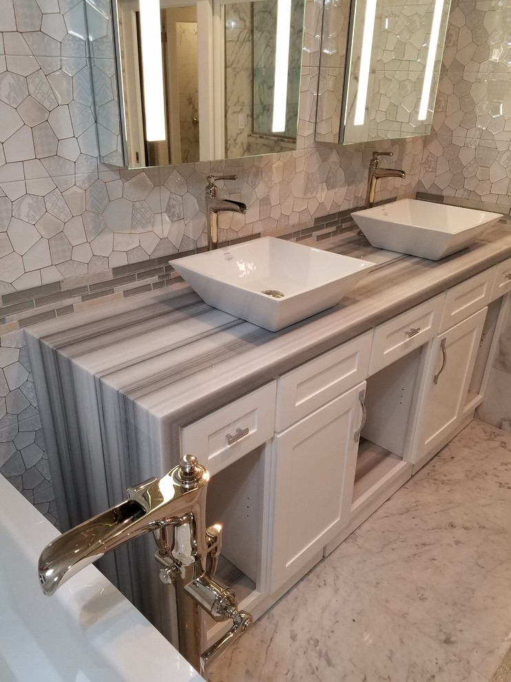 Inspiration for a large modern master marble floor bathroom remodel in San Diego with shaker cabinets, white cabinets, beige walls, a vessel sink and a hinged shower door