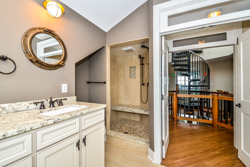 Example of a beach style master beige tile, black and white tile, multicolored tile and stone slab porcelain tile bathroom design in DC Metro with shaker cabinets, dark wood cabinets, a two-piece toilet, an undermount sink, granite countertops and gray walls