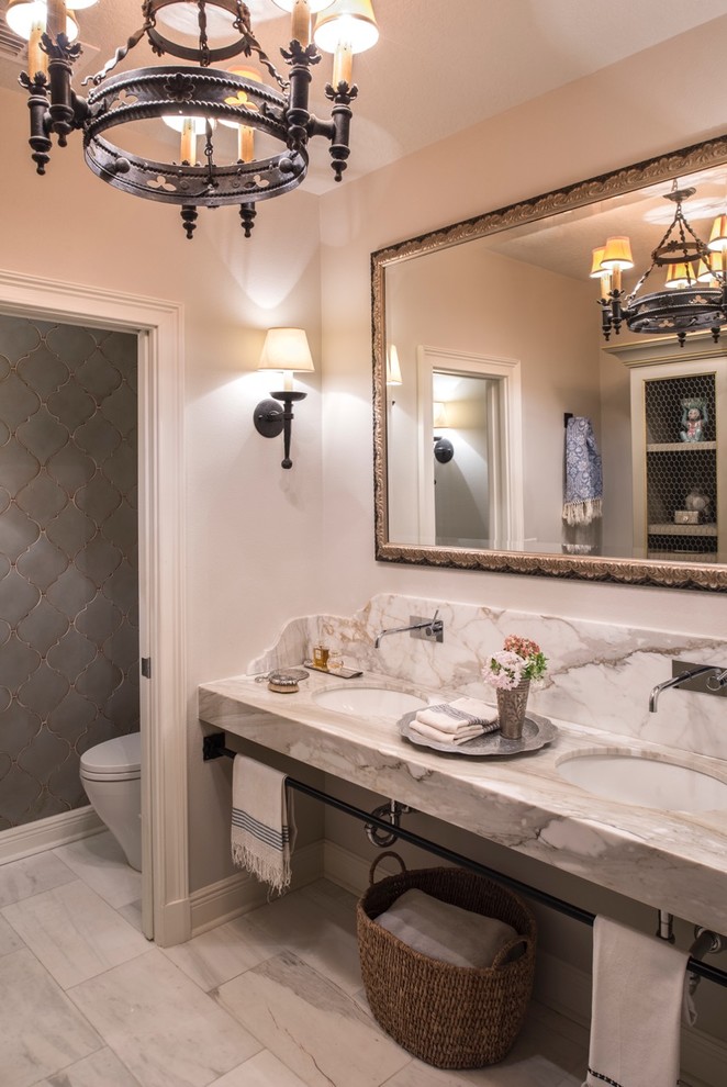 Example of a mid-sized eclectic master gray tile, white tile and stone slab marble floor alcove shower design in Orlando with a two-piece toilet, gray walls, an undermount sink and marble countertops