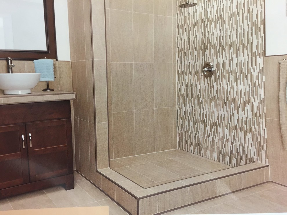 Photo of a small contemporary shower room bathroom in Nashville with recessed-panel cabinets, dark wood cabinets, a corner shower, beige tiles, matchstick tiles, beige walls, ceramic flooring, a vessel sink, tiled worktops and beige floors.