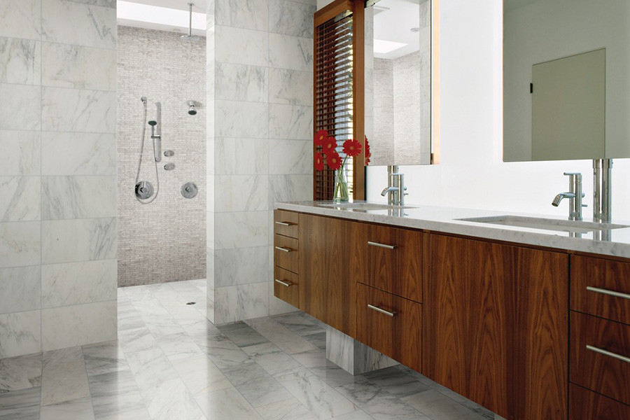 This is an example of a large modern ensuite bathroom in Austin with flat-panel cabinets, brown cabinets, a walk-in shower, white walls, marble flooring, a built-in sink, marble worktops, white floors and an open shower.
