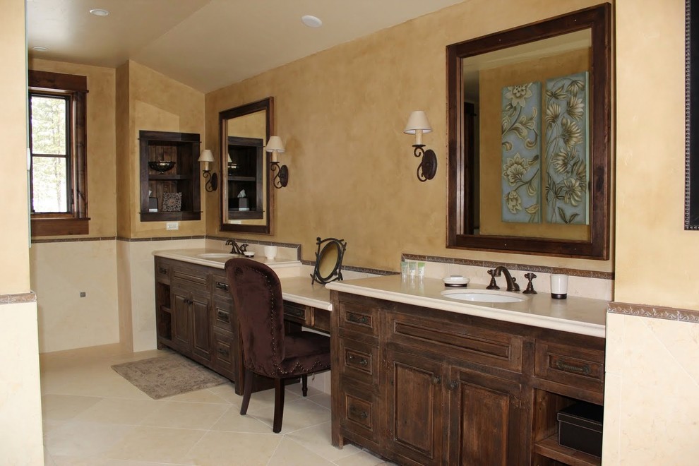 This is an example of a large classic ensuite bathroom in Other with shaker cabinets, dark wood cabinets, an alcove bath, an alcove shower, a two-piece toilet, beige tiles, stone tiles, beige walls, porcelain flooring, a built-in sink, granite worktops and grey floors.