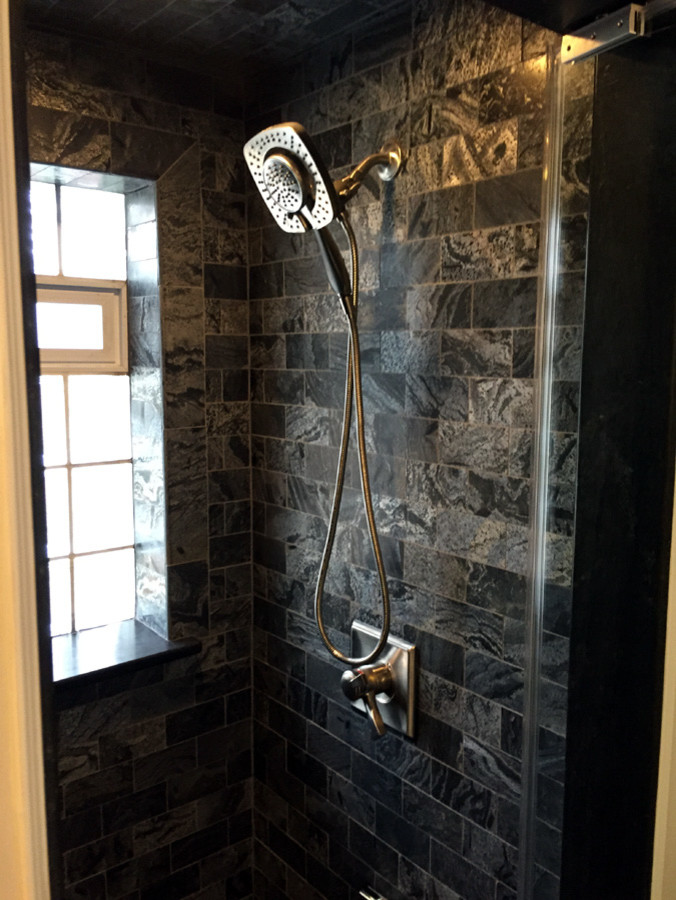 Mid-sized master black tile and stone tile slate floor doorless shower photo in Indianapolis with white cabinets and soapstone countertops