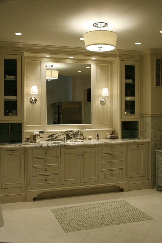 Example of a large transitional master gray tile ceramic tile bathroom design in Chicago with recessed-panel cabinets, distressed cabinets, marble countertops and beige walls