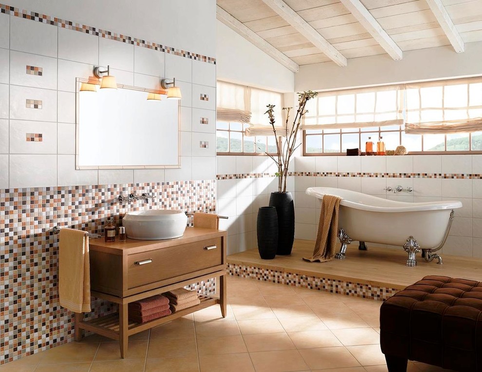 Exemple d'une salle de bain principale tendance en bois brun de taille moyenne avec un placard à porte plane, une baignoire sur pieds, des carreaux de porcelaine, un mur blanc, un sol en carrelage de porcelaine, une vasque et un plan de toilette en bois.