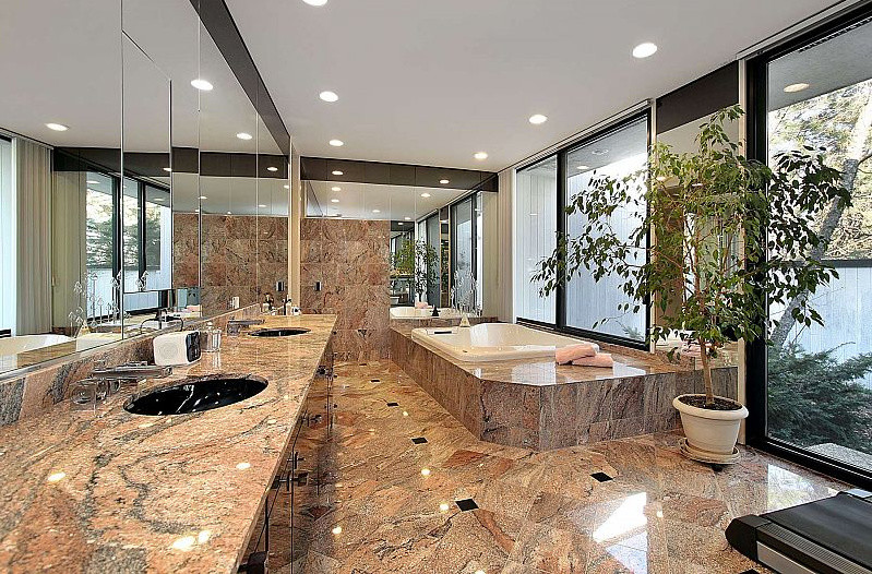 Пример оригинального дизайна: большая главная ванная комната в стиле модернизм с плоскими фасадами, темными деревянными фасадами, накладной ванной, коричневой плиткой, бежевыми стенами, врезной раковиной, столешницей из гранита, коричневым полом и коричневой столешницей
