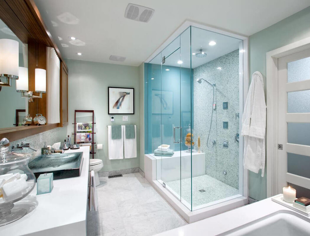 This is an example of a contemporary bathroom in New York with a submerged bath, a corner shower, white tiles, mosaic tiles, green walls, a vessel sink, white floors and a hinged door.