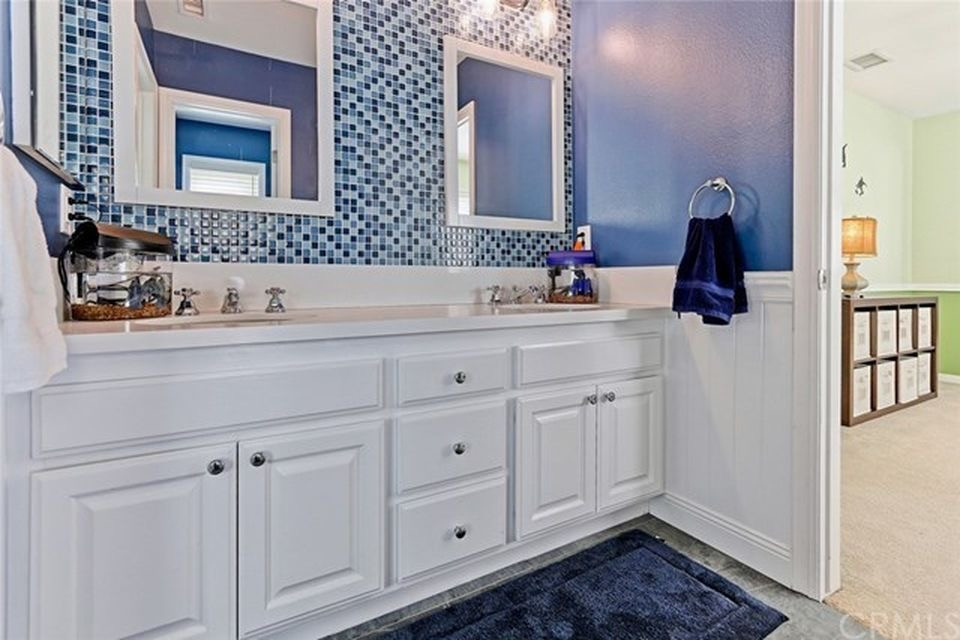 Inspiration for a small coastal kids' multicolored tile and glass sheet slate floor and gray floor bathroom remodel in Portland with white cabinets, a two-piece toilet, blue walls, an undermount sink, quartz countertops and white countertops