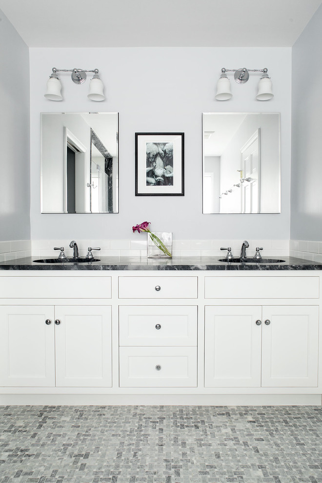 Photo of a traditional bathroom in New York with white cabinets, grey walls, shaker cabinets, white tiles and metro tiles.