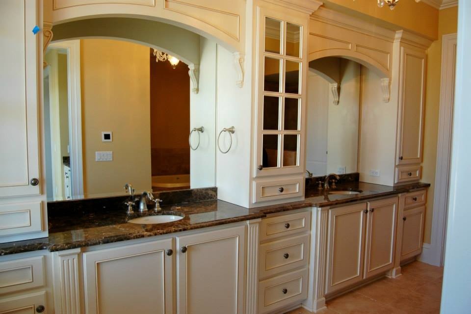 Large elegant master beige tile and porcelain tile ceramic tile bathroom photo in Charleston with a drop-in sink, raised-panel cabinets, white cabinets, granite countertops and beige walls