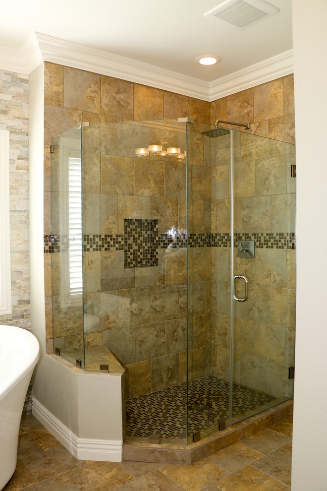 This is an example of a large classic ensuite bathroom in Other with a submerged sink, raised-panel cabinets, white cabinets, granite worktops, a freestanding bath, a corner shower, a two-piece toilet, multi-coloured tiles, porcelain tiles, beige walls and porcelain flooring.