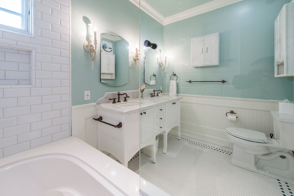 Inspiration for a mid-sized coastal 3/4 white tile and subway tile mosaic tile floor and white floor bathroom remodel in Los Angeles with furniture-like cabinets, white cabinets, green walls, an undermount sink, marble countertops and white countertops