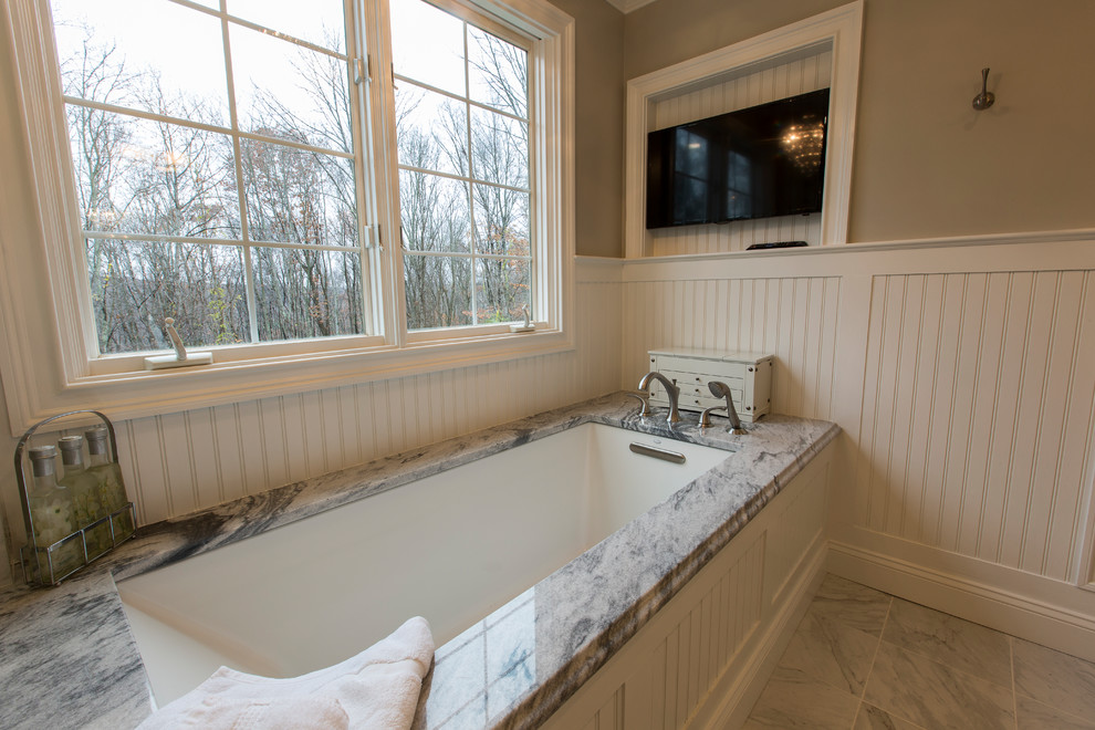 Inspiration for a mid-sized timeless master white tile and porcelain tile porcelain tile and white floor bathroom remodel in Bridgeport with furniture-like cabinets, white cabinets, an undermount tub, a two-piece toilet, beige walls, a vessel sink, marble countertops and a hinged shower door