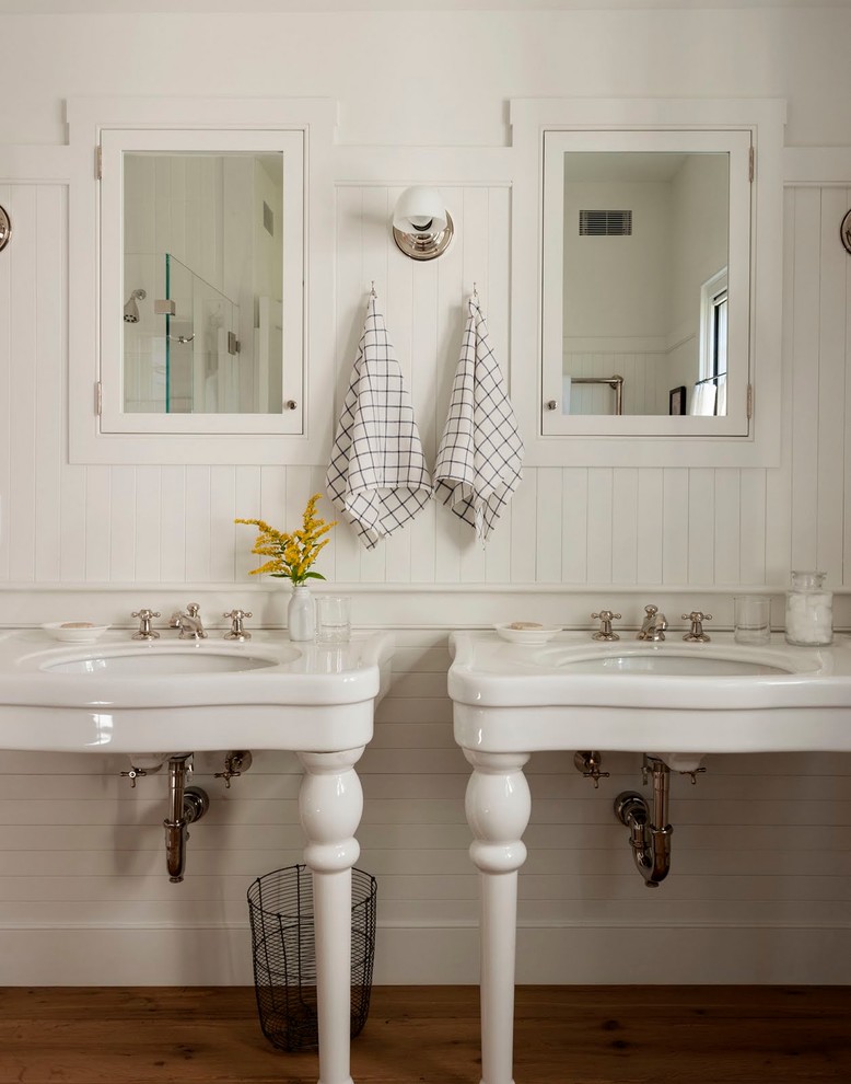 Inspiration for a country dark wood floor bathroom remodel in Boston with white walls and an undermount sink